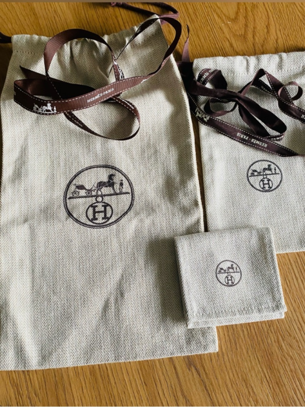 The Hermes Authentic 3 Piece Dust-bag and Ribbon Set.